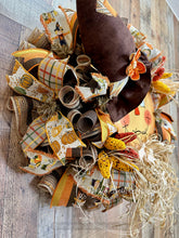Load image into Gallery viewer, Scarecrow Wreath with Fall Ribbons and Raffia – 28x25 Inches
