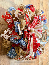 Load image into Gallery viewer, Rodeo Life Western Cowboy Wreath – Patriotic Cow Print &amp; Bandana Mesh Door Decor

