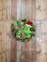 Load image into Gallery viewer, Green Monster Christmas Wreath with Santa Hat, Red and Lime Green Ribbon and Ornaments
