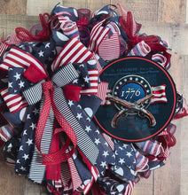 Load and play video in Gallery viewer, Patriotic 1776 Americana Wreath – Red White and Blue Deco Mesh Front Door Wreath with Revolutionary War Sign
